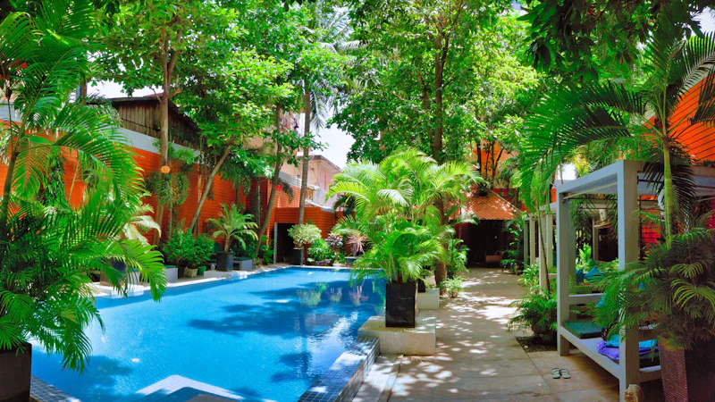 Resort pool surrounded by tropical planting